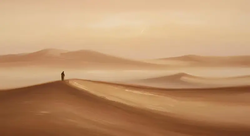Man Standing in a Dessert on Top of a Dune